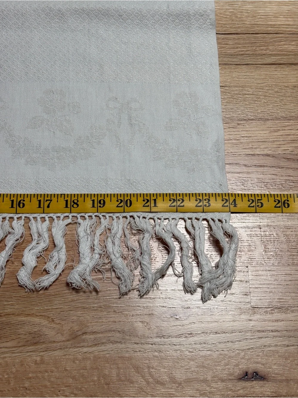 Textured off-white woven vintage towel set featuring decorative knotted fringe